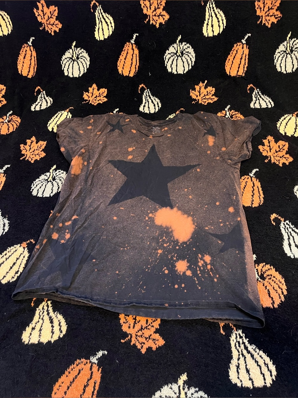 #22 Black Star Tee with Orange Bleach Splatter available on live sept 7th 9am ms